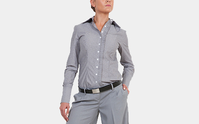 Model wearing women's silver button up shirt